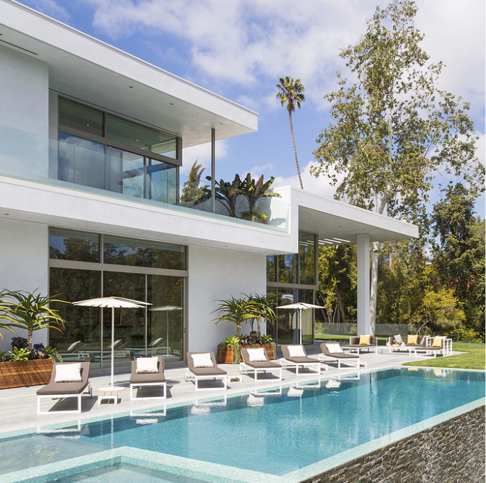 Resort Inspired In-Ground Pool with Elevated Stone Detailing